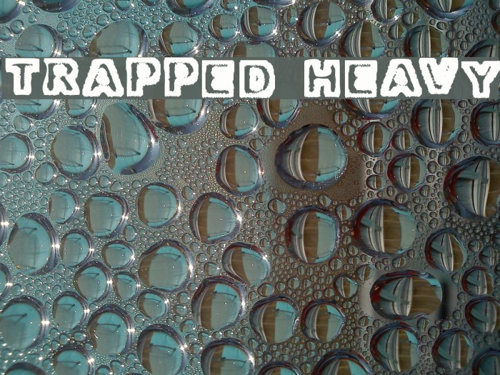 Trapped Heavy Font examples
